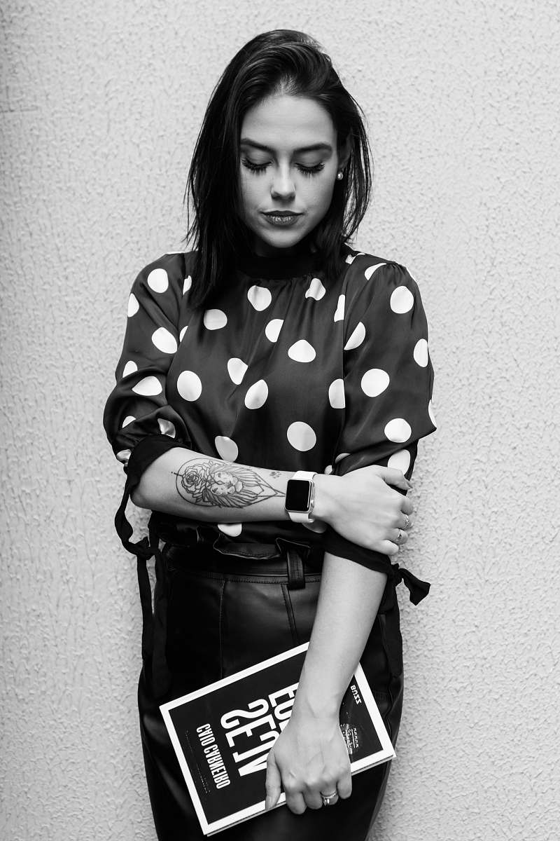 black-and-white grayscale photo of woman in polka-dot quarter-sleeved shirt human
