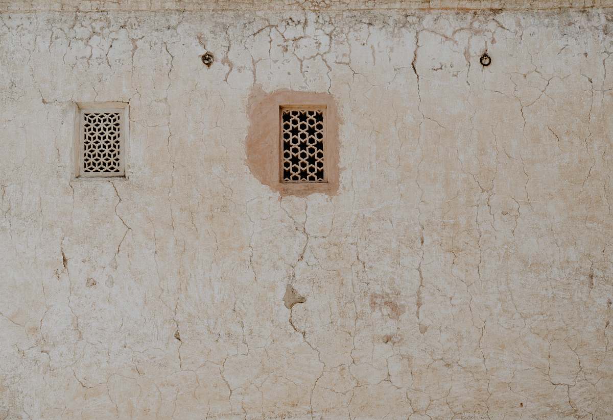 wall photography of closed window amber palace
