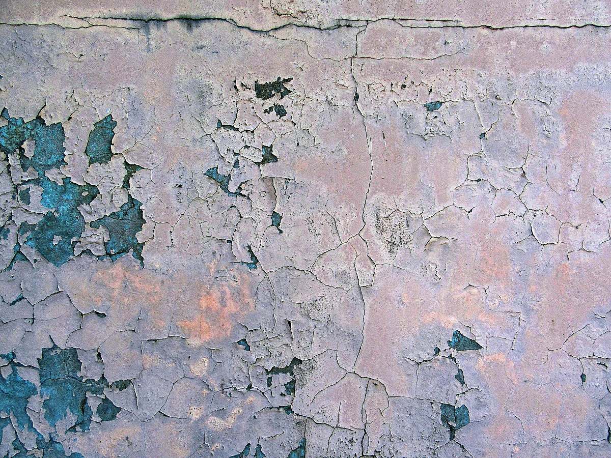 grey wall with cracked surface wall