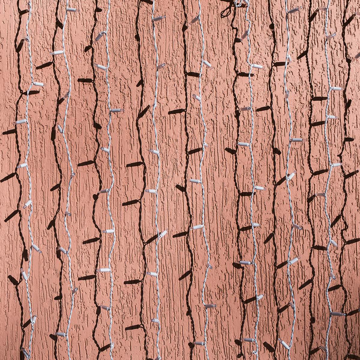 rug white string lights hanging across brown wall wood