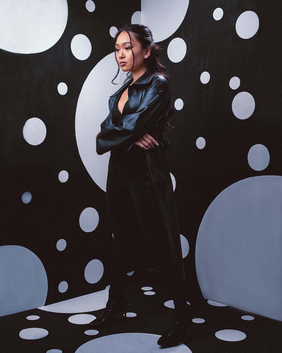 human woman in black coat standing person