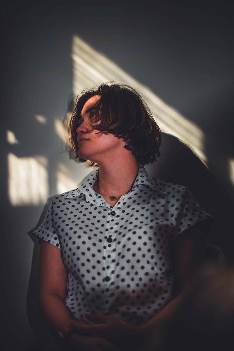 apparel woman in white and black polka dot button up shirt clothing