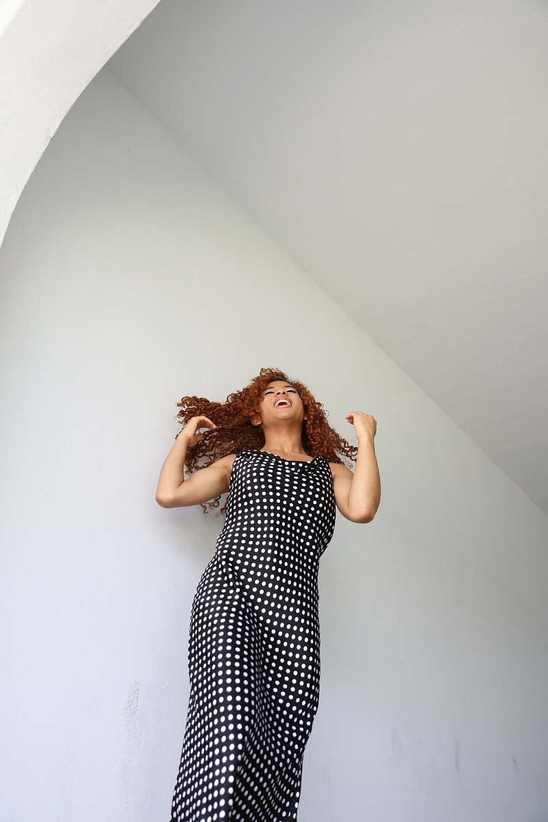 apparel woman near wall clothing