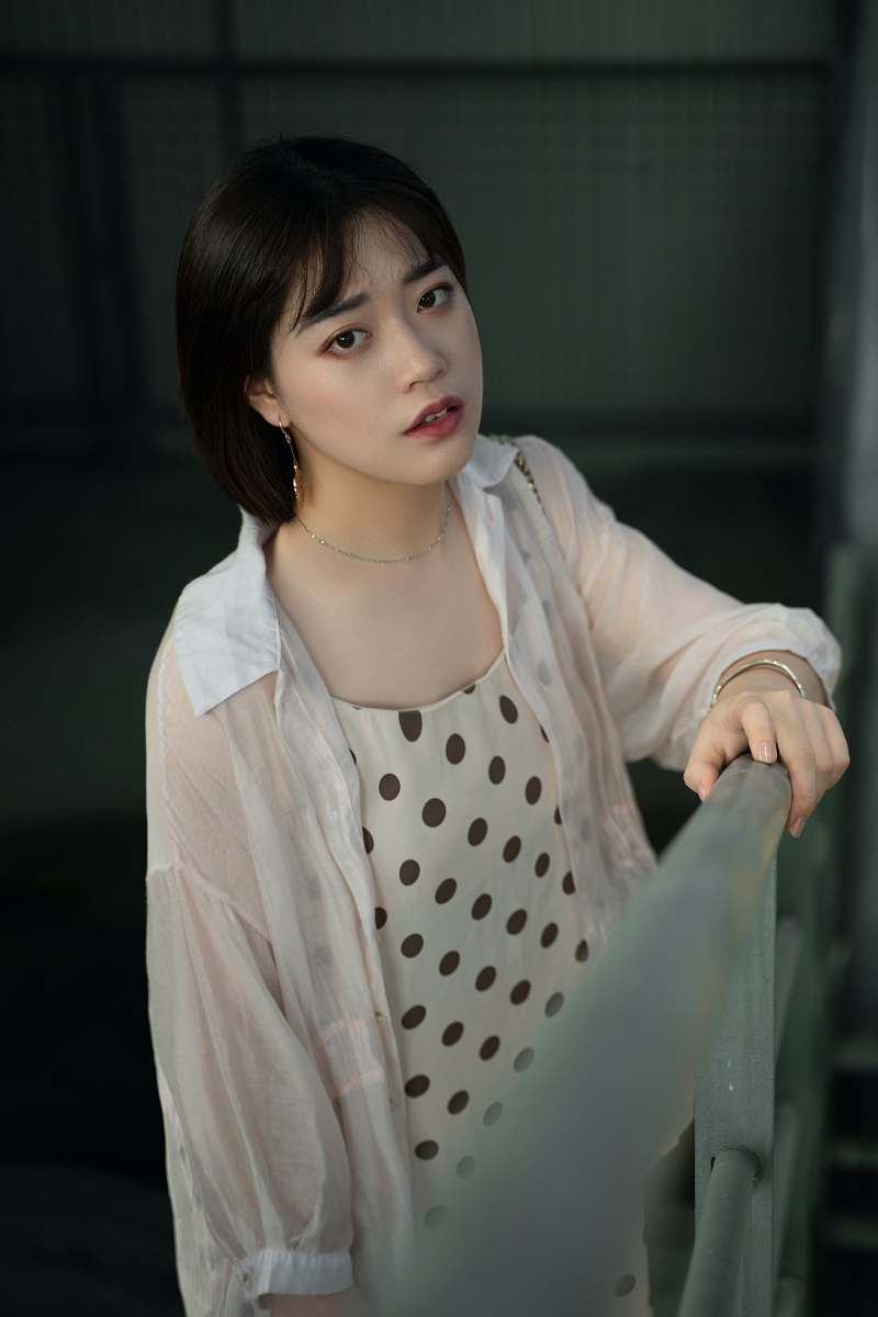 human woman standing beside railings person