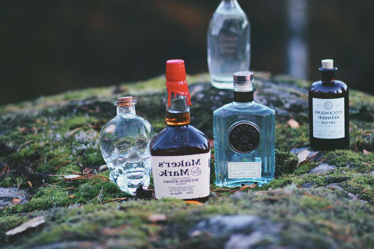drink five assorted-brand bottles on top of grasses gin