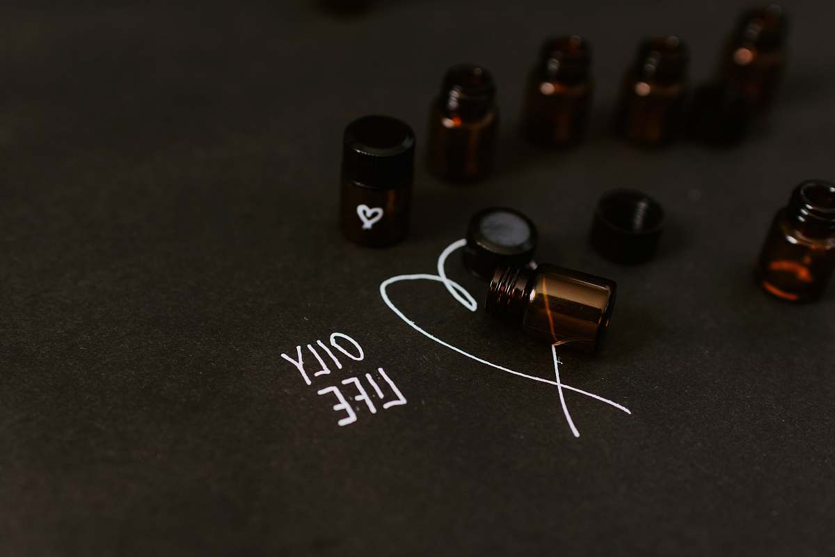 weaponry seven small bottle in black surface close-up photography weapon