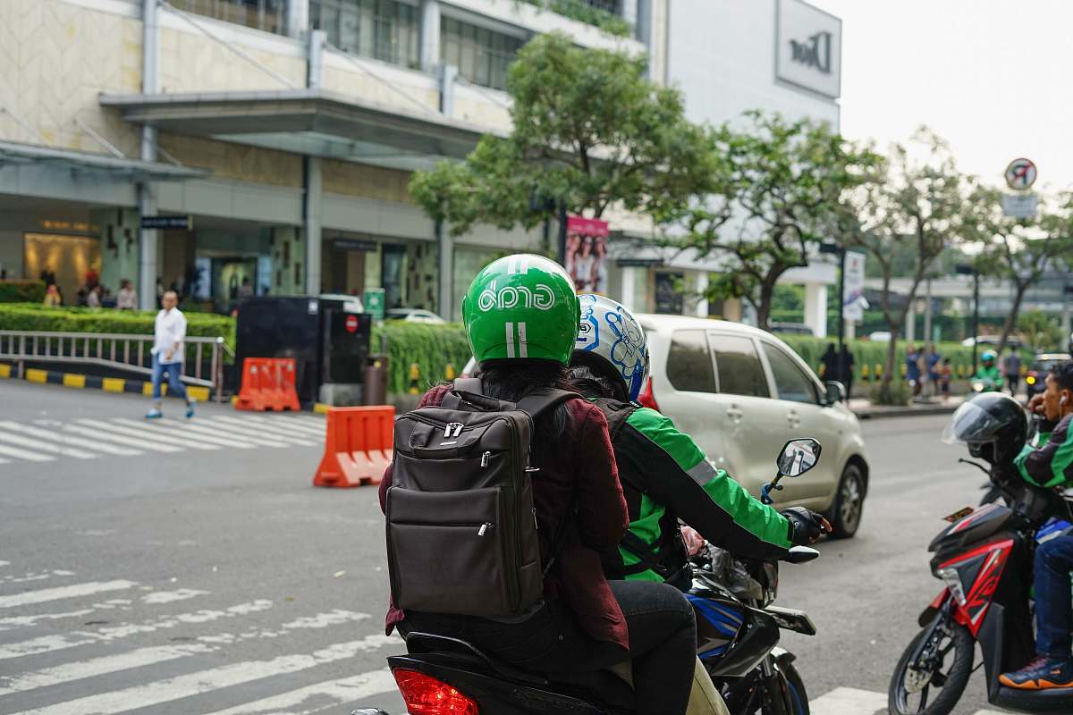 clothing man riding bicycle helmet