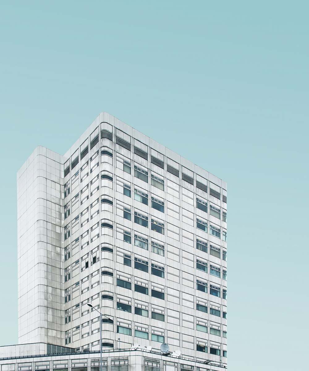 building architectural photography of white concrete high-rise building skyscraper