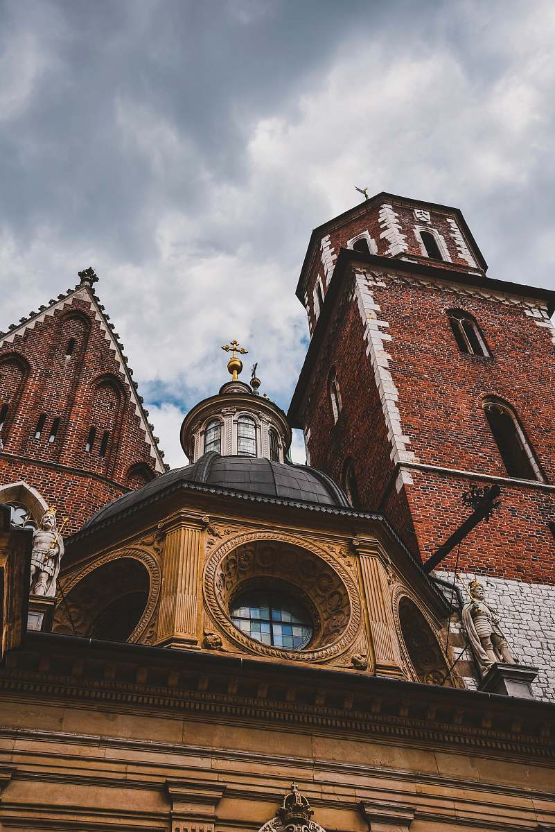 building low-angle photography of brown and white concrete cathedral tower