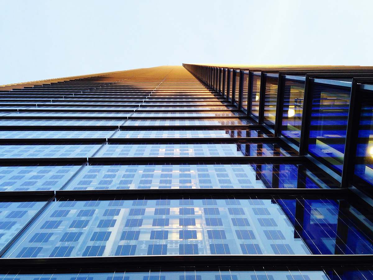 building low angle photography of building sun
