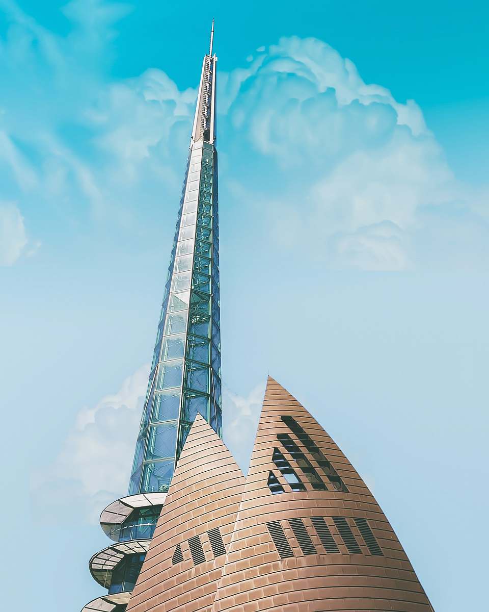 tower low angle photography of curtain-wall tower building under blue skies during daytime perth