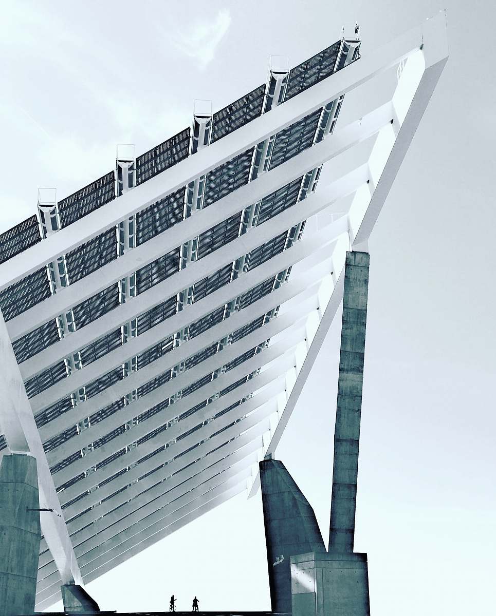 urban person under white and gray concrete structure during daytime photography skyscraper