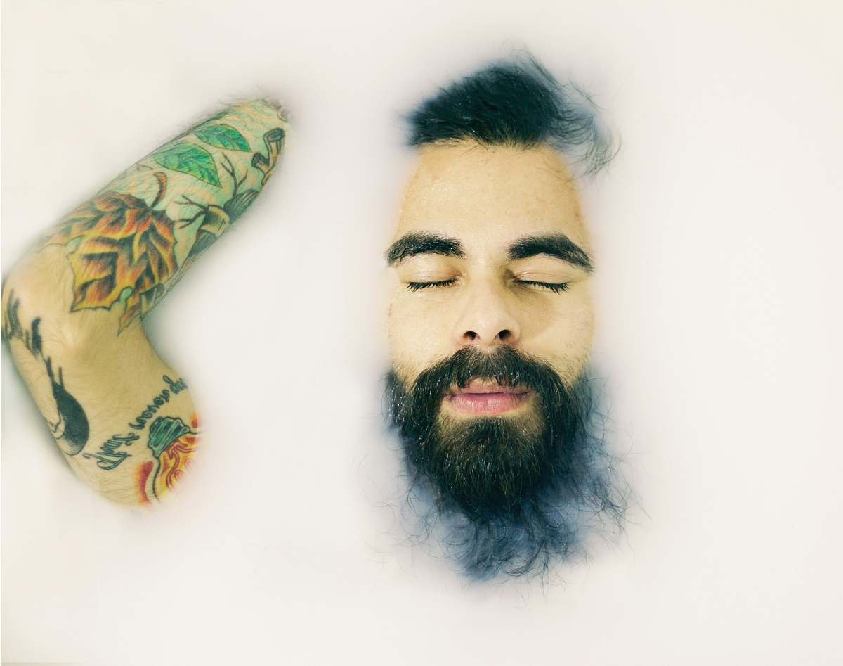 tattoo man closing his eyes man