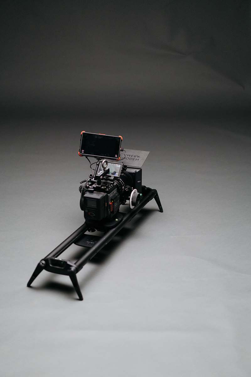 grey black video camera with slider machine