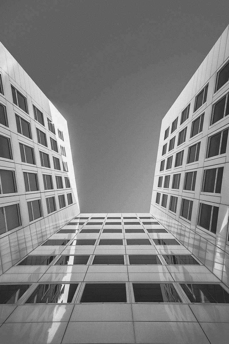building low angle photography of curtain building office building