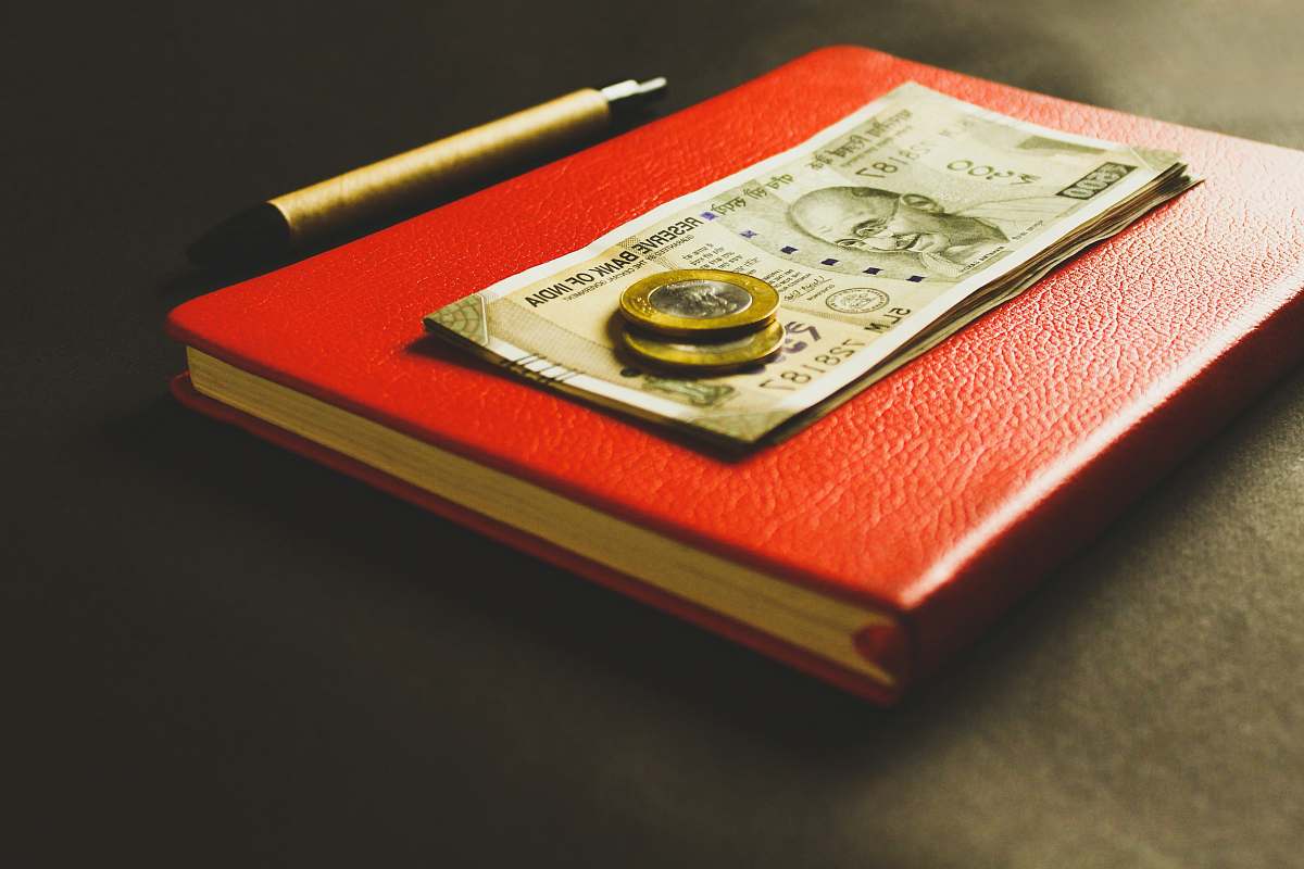 text two coins on banknotes financing