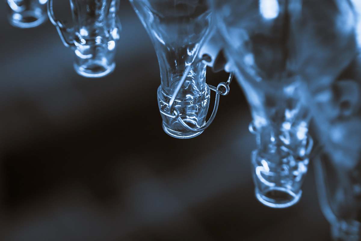 bottles macro shot photography of clear glass bottles glass