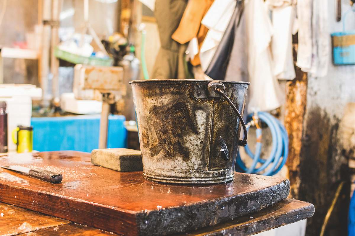 tokyo gray bucket on wooden table pale