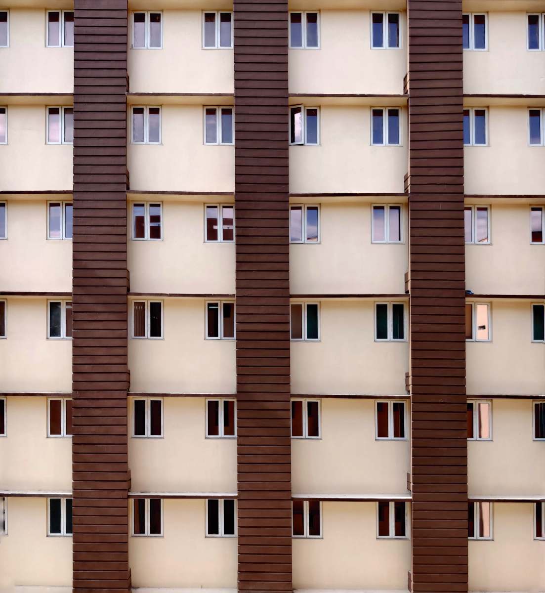 city architectural photo of brown and beige building high rise