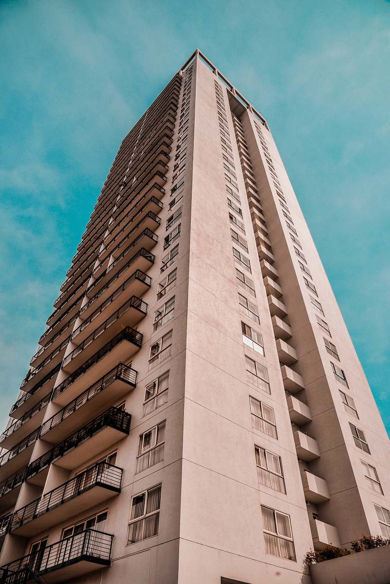 city beige concrete building high rise