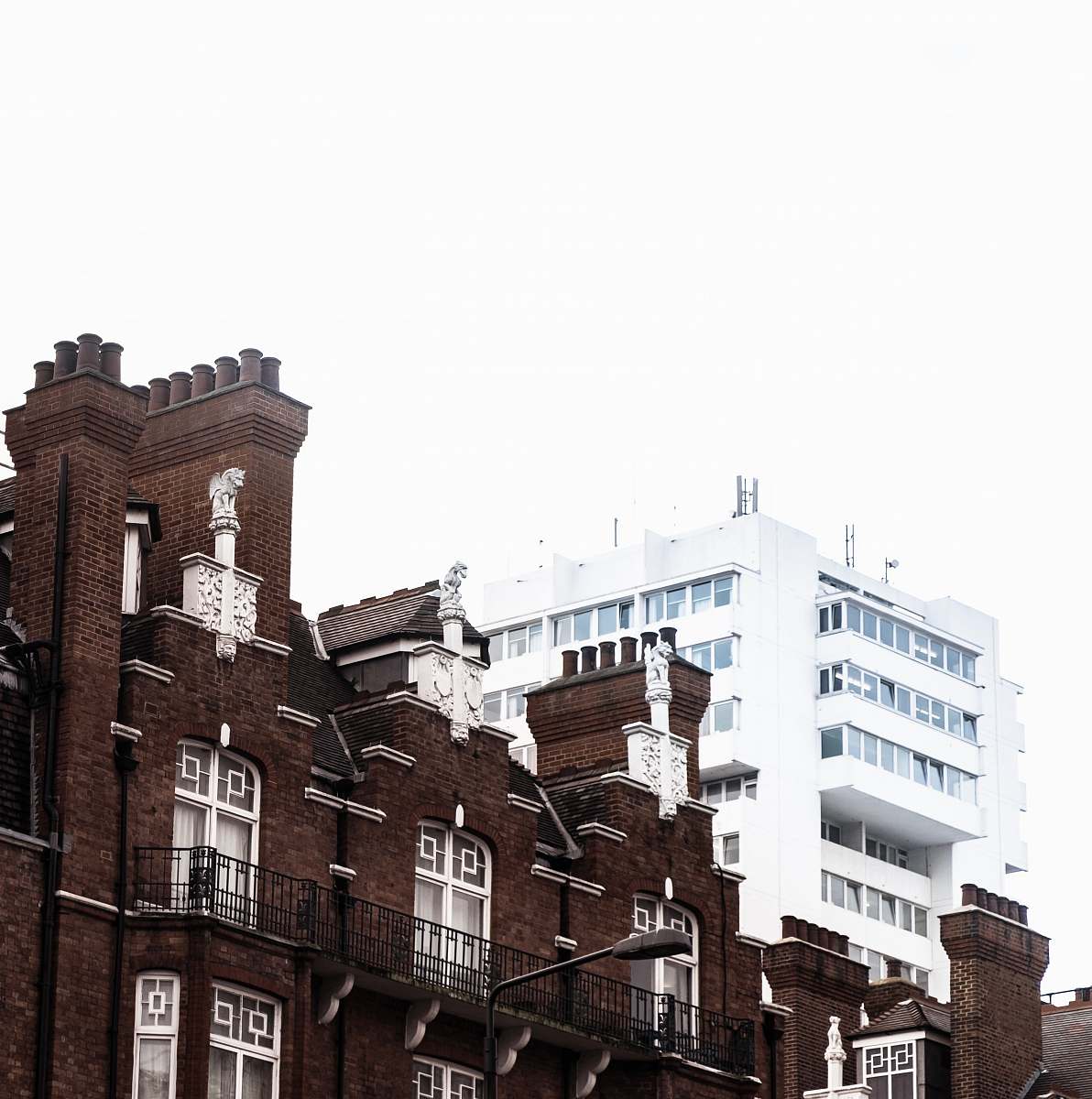 city brown and white concrete buildings under white sky during daytime urban