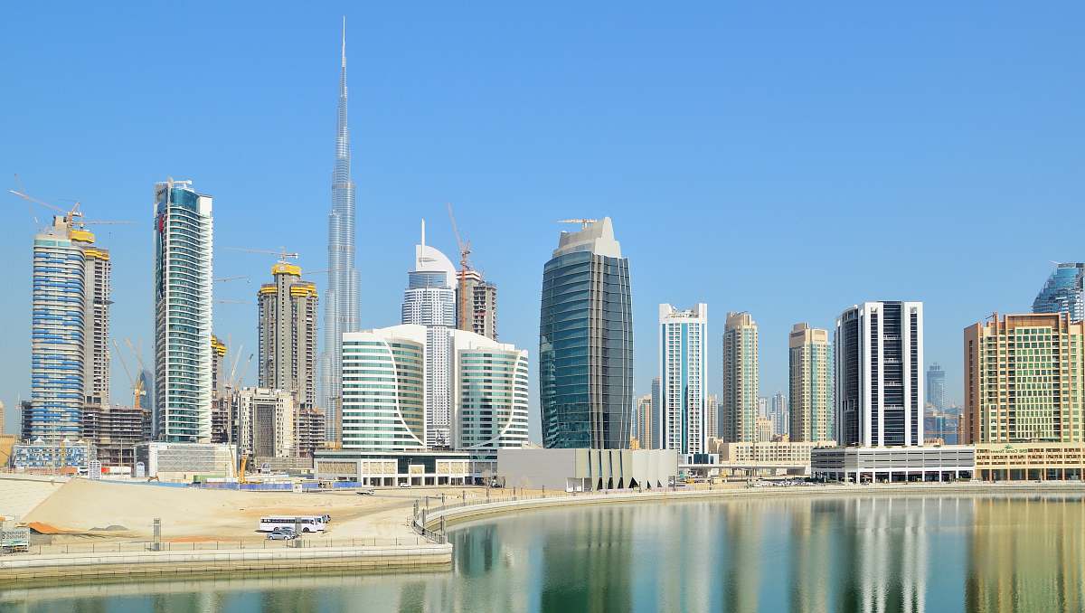 city city with high-rise buildings viewing blue body of water during daytime high rise