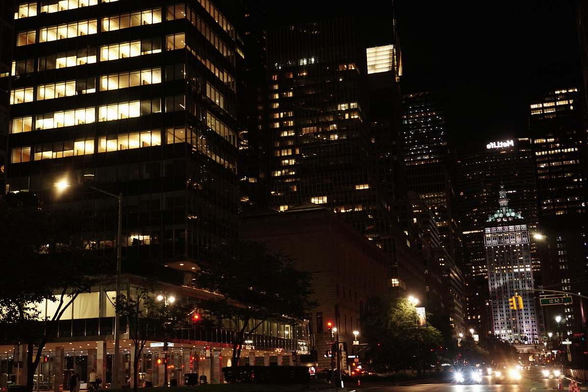 city concrete high rise building during night time metropolis
