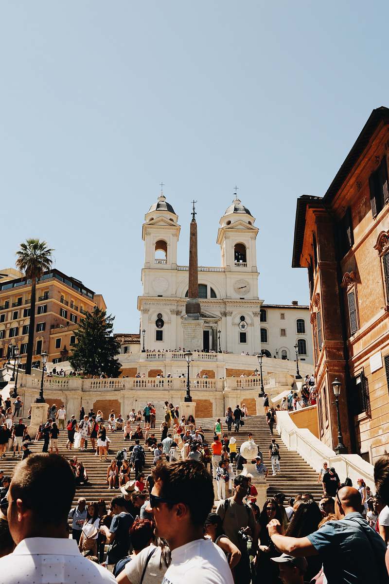 human crowd near cathedral person