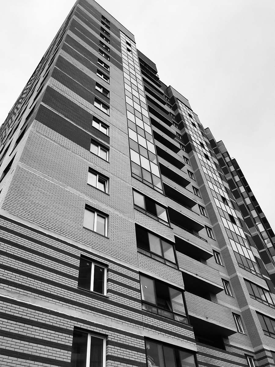 city gray highrise building black-and-white