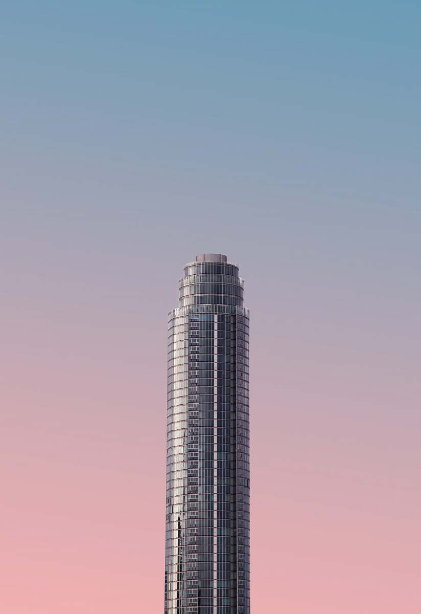 architecture gray tower building under blue sky grey