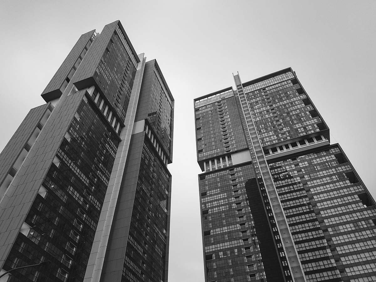 architecture grayscale low-angle photography of concrete building black-and-white