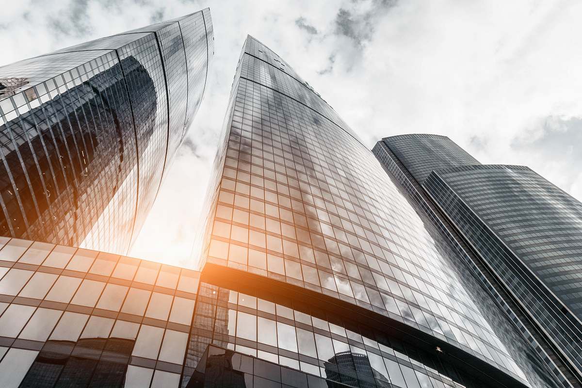 city grey curtain building during daytime urban