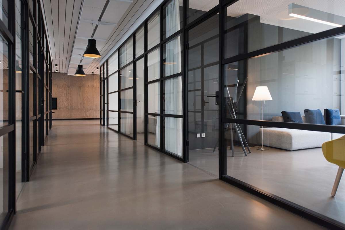 office hallway between glass-panel doors corridor