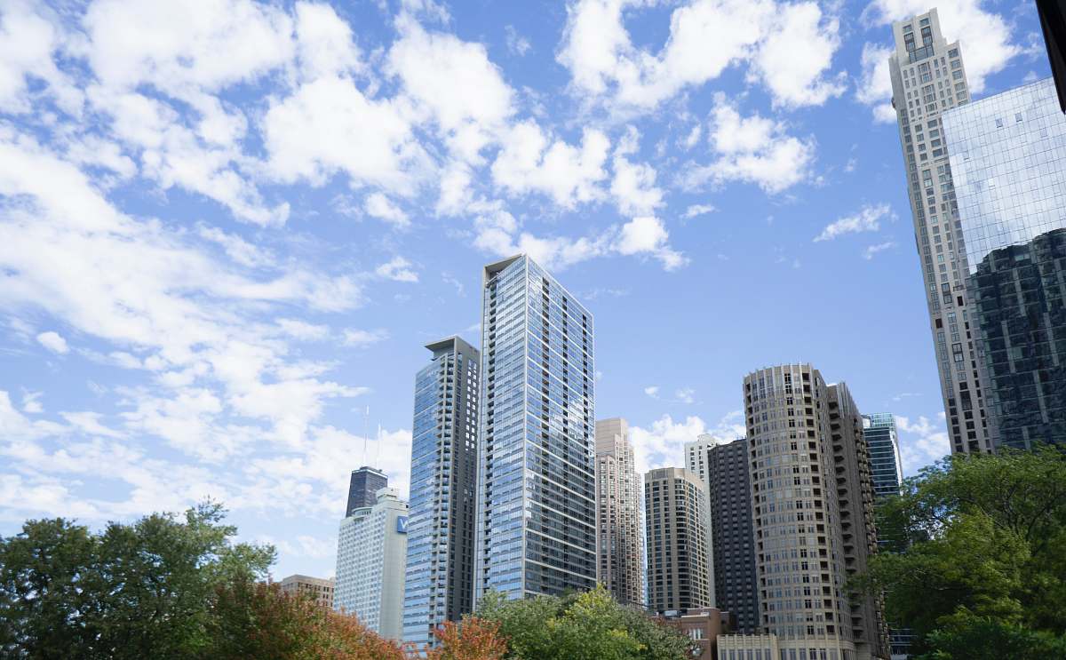 city high-rise building under blue sky high rise
