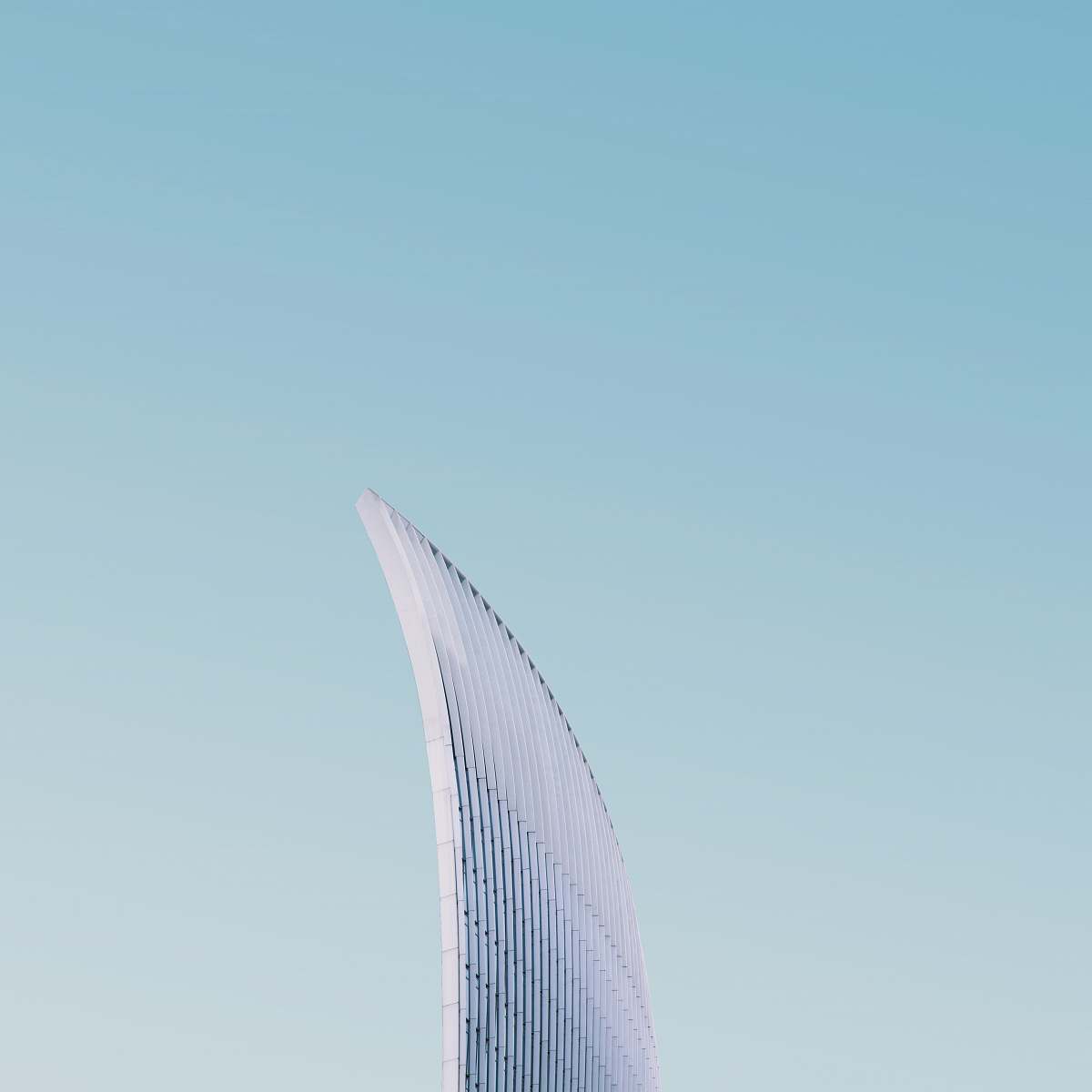 urban high-rise building under clear blue sky city