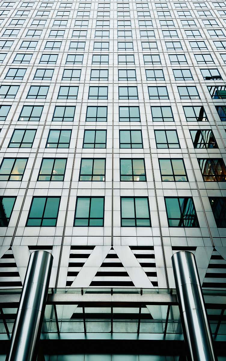 city high-rise gray concrete building during daytime architecture