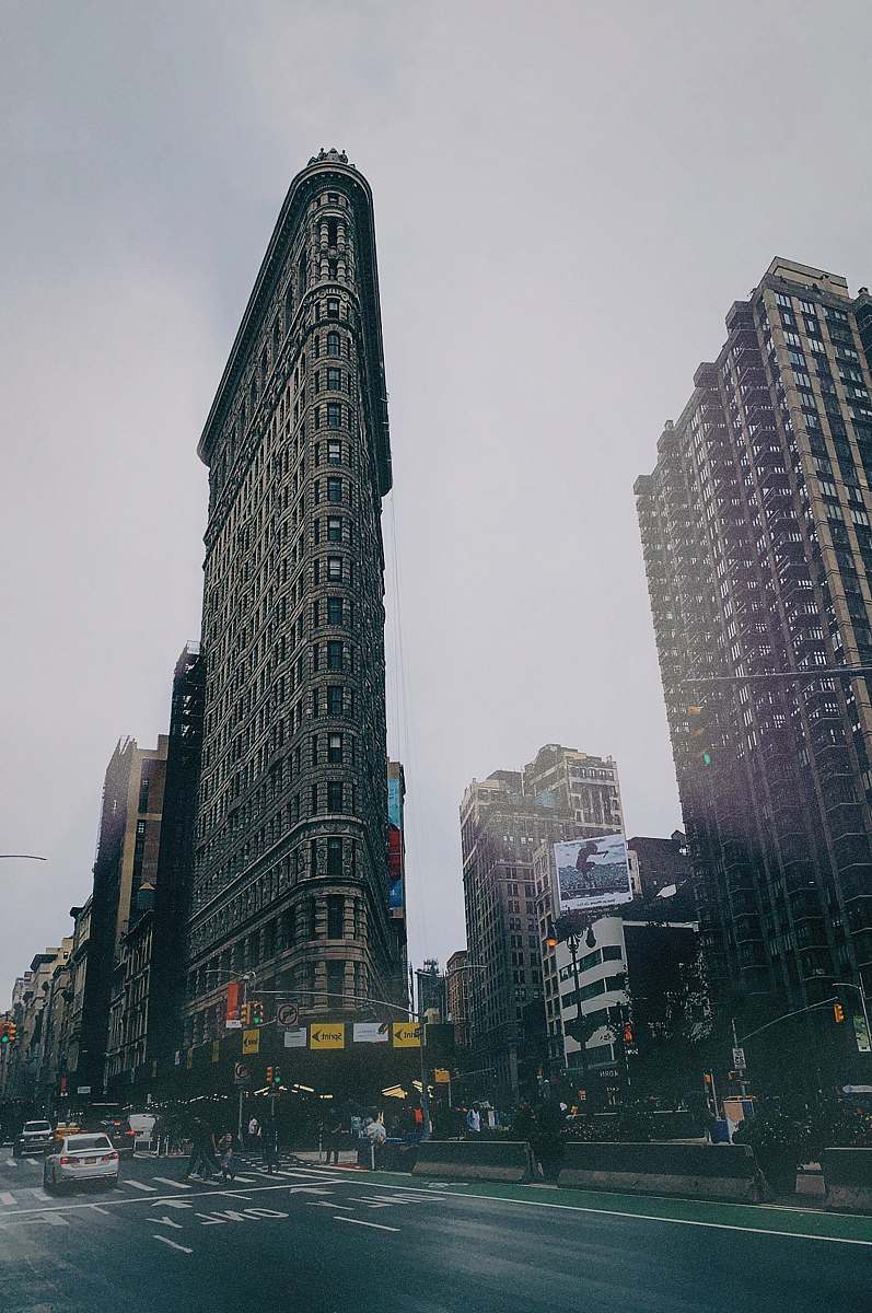 city low angel photography of high rise building under gray sky high rise