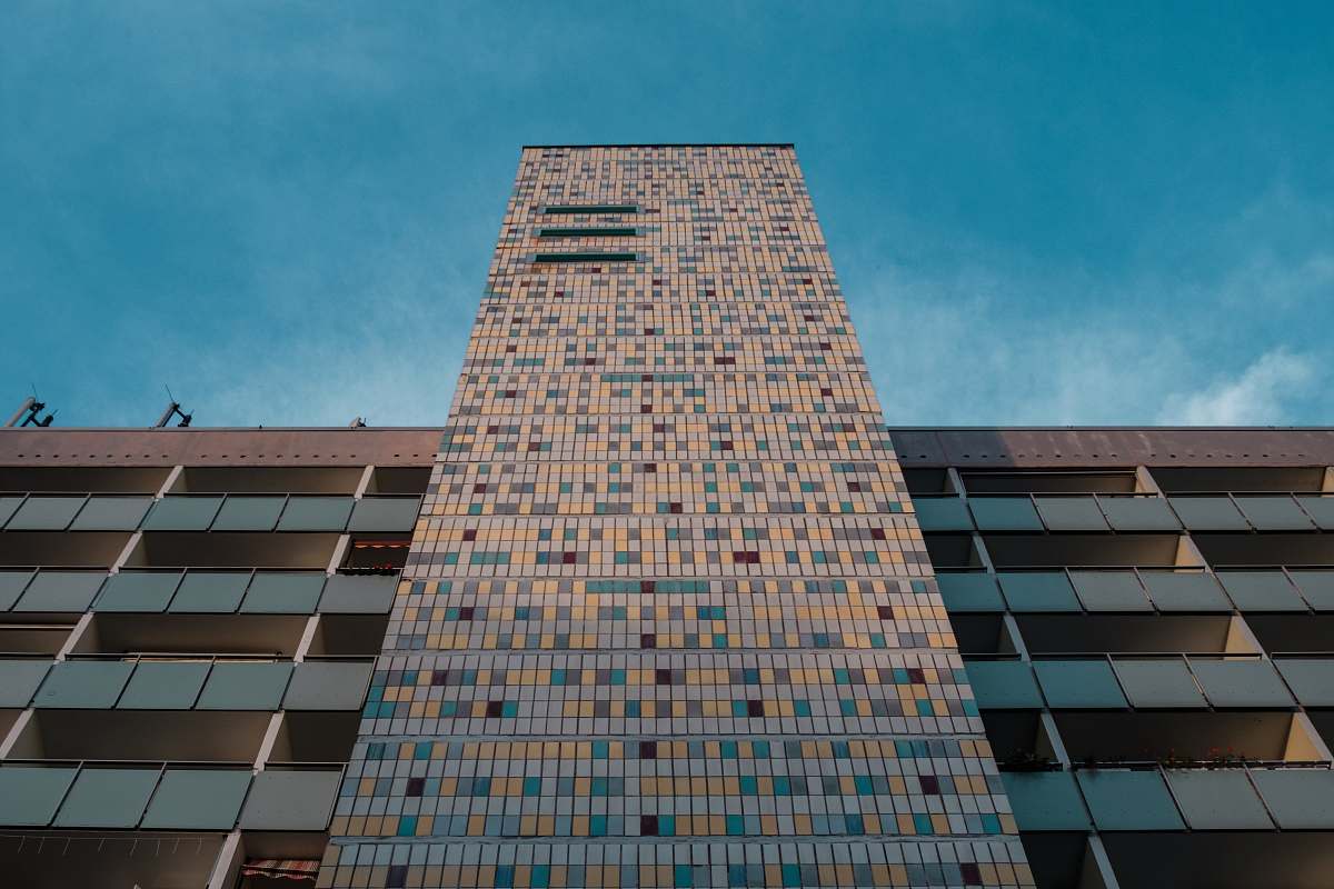 city low angle photo of brown brick building office building