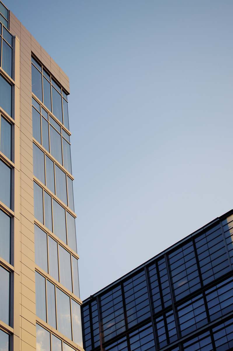 condo low angle photo of curtain glass wall building office building