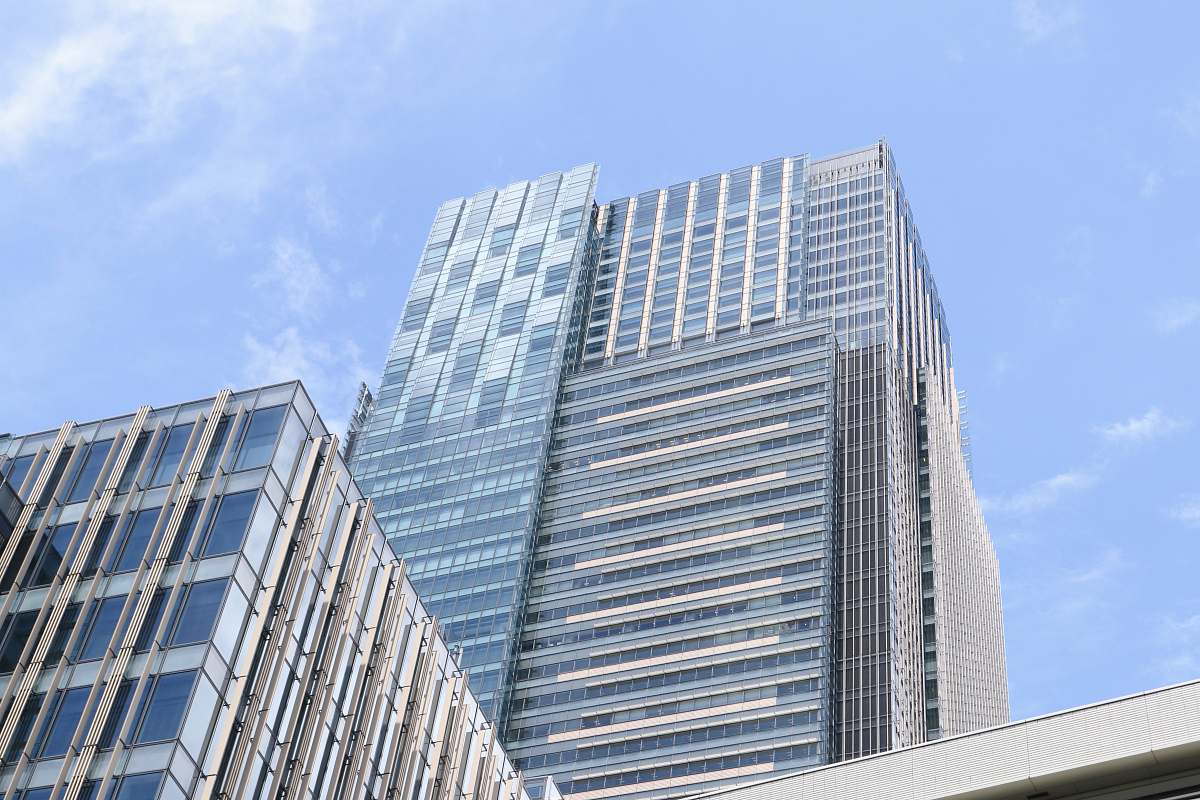 city low-angle photo of high rise buildings office building