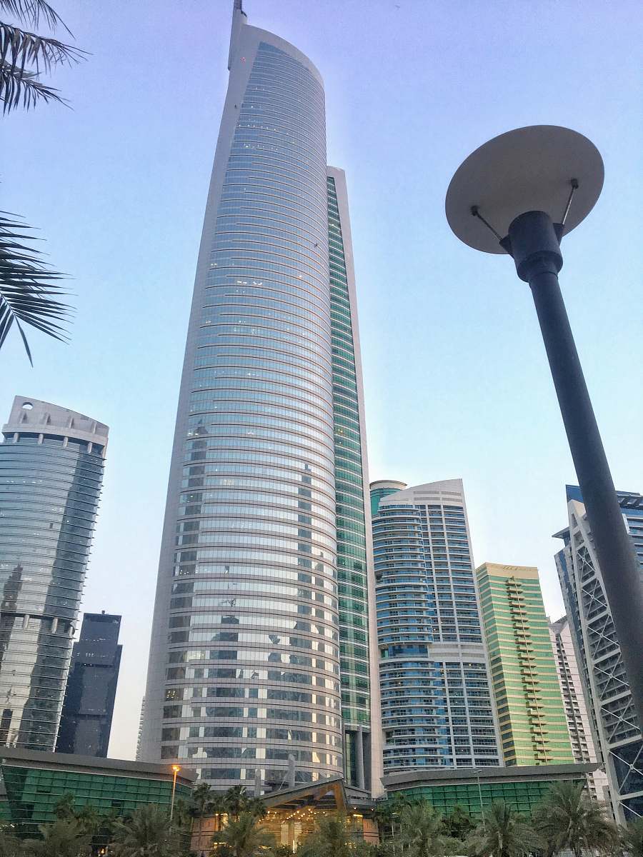 city low angle photo of high-rise glass curtain buildings at daytime high rise