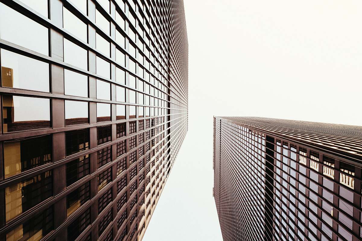 urban low angle photo of highrise building during daytime skyscraper