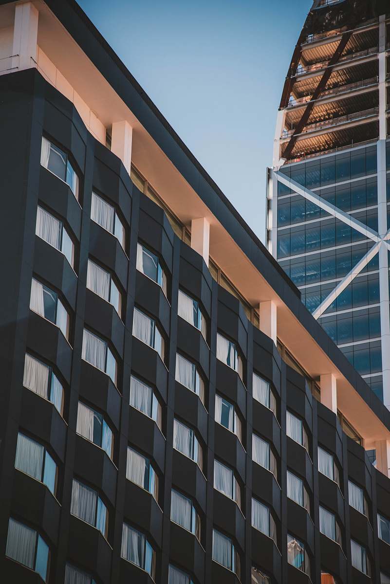 city low-angle photography of black and brown high-rise building during daytime office building