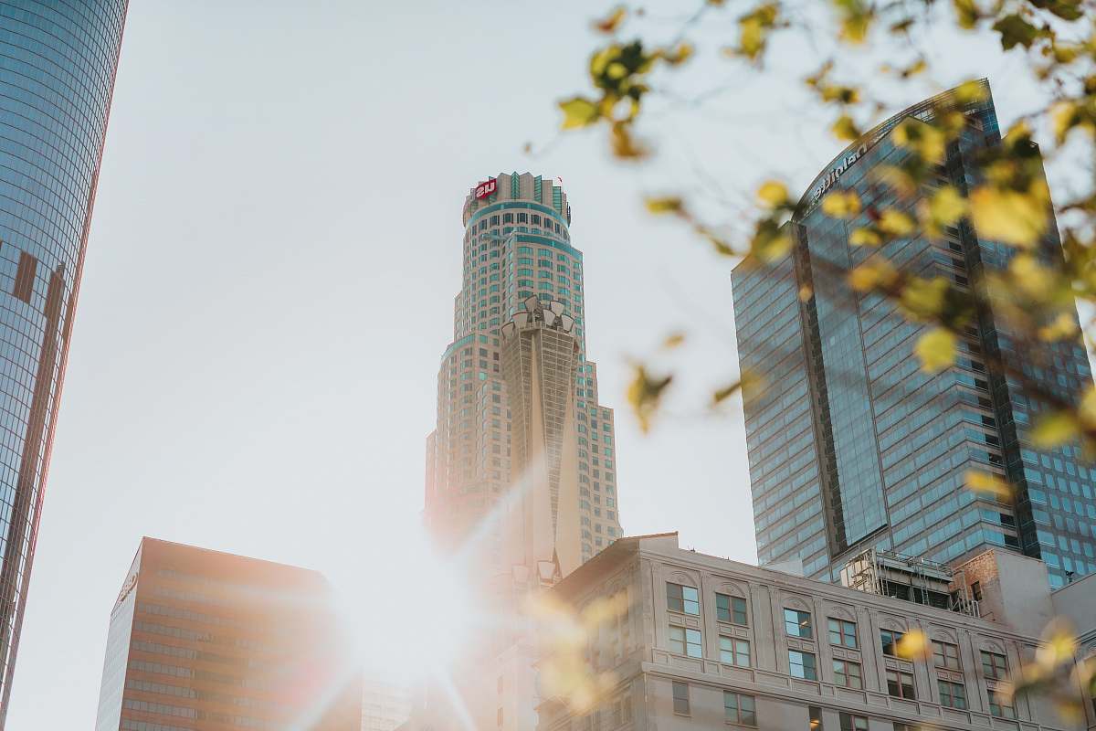city low angle photography of glass high rise building housing