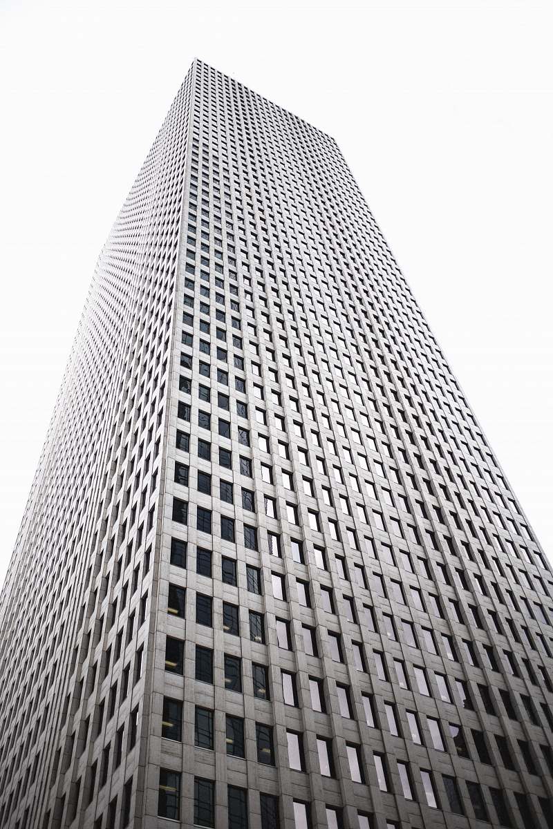 black-and-white low-angle photography of gray high rise building grey