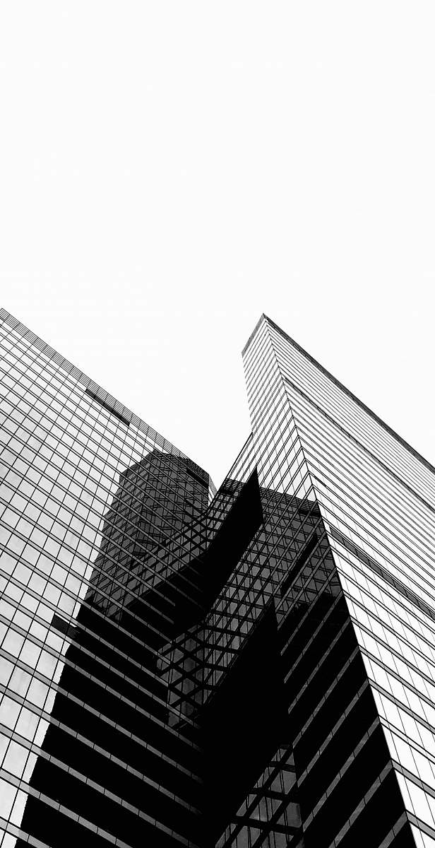 black-and-white low-angle photography of high-rise building architecture