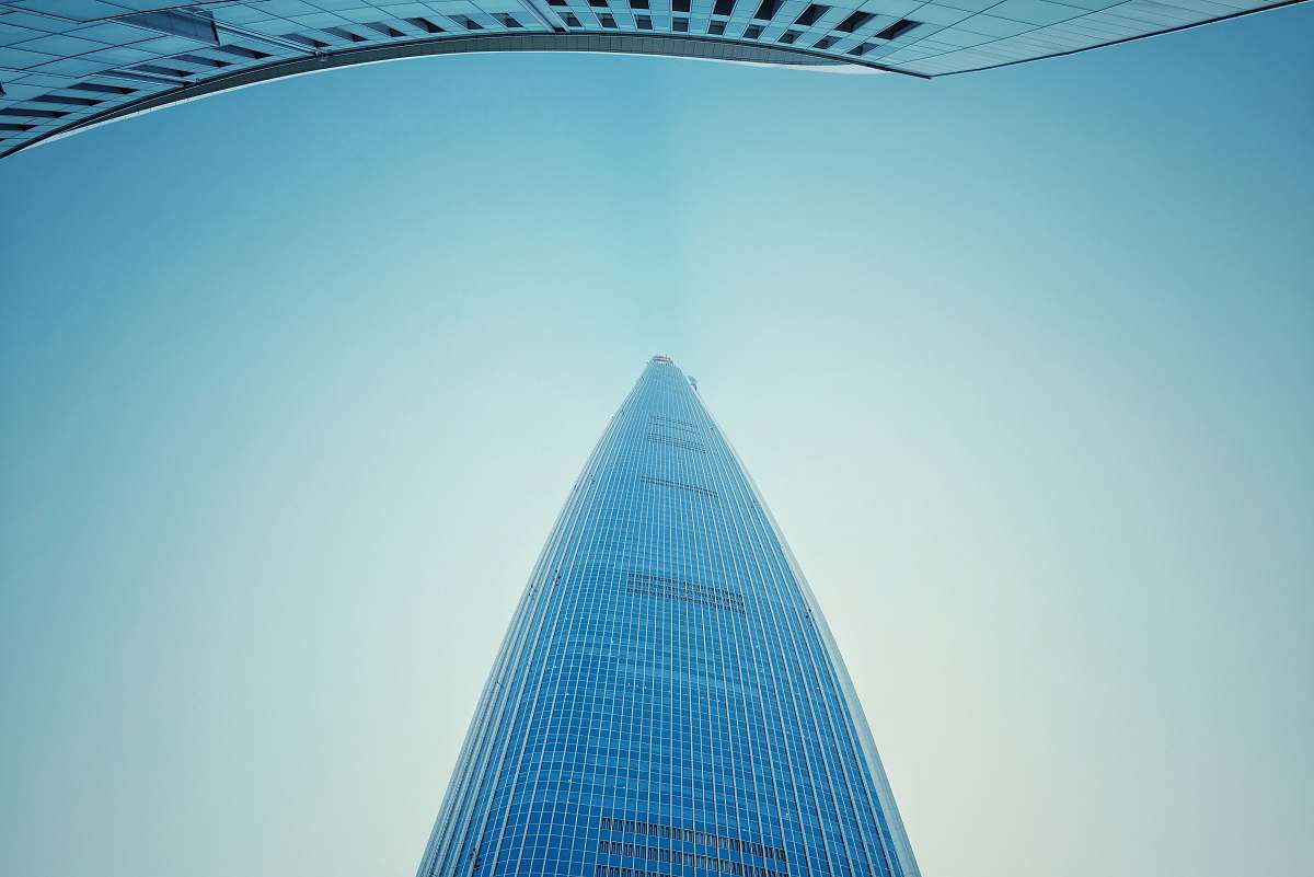 city low-angle view photography of blue mirror building high rise