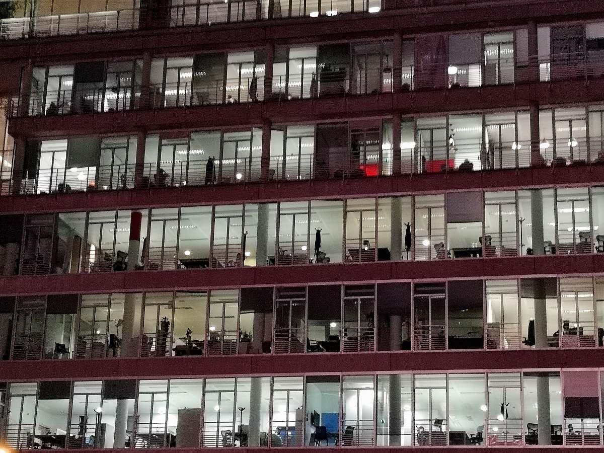 city maroon high-rise building high rise