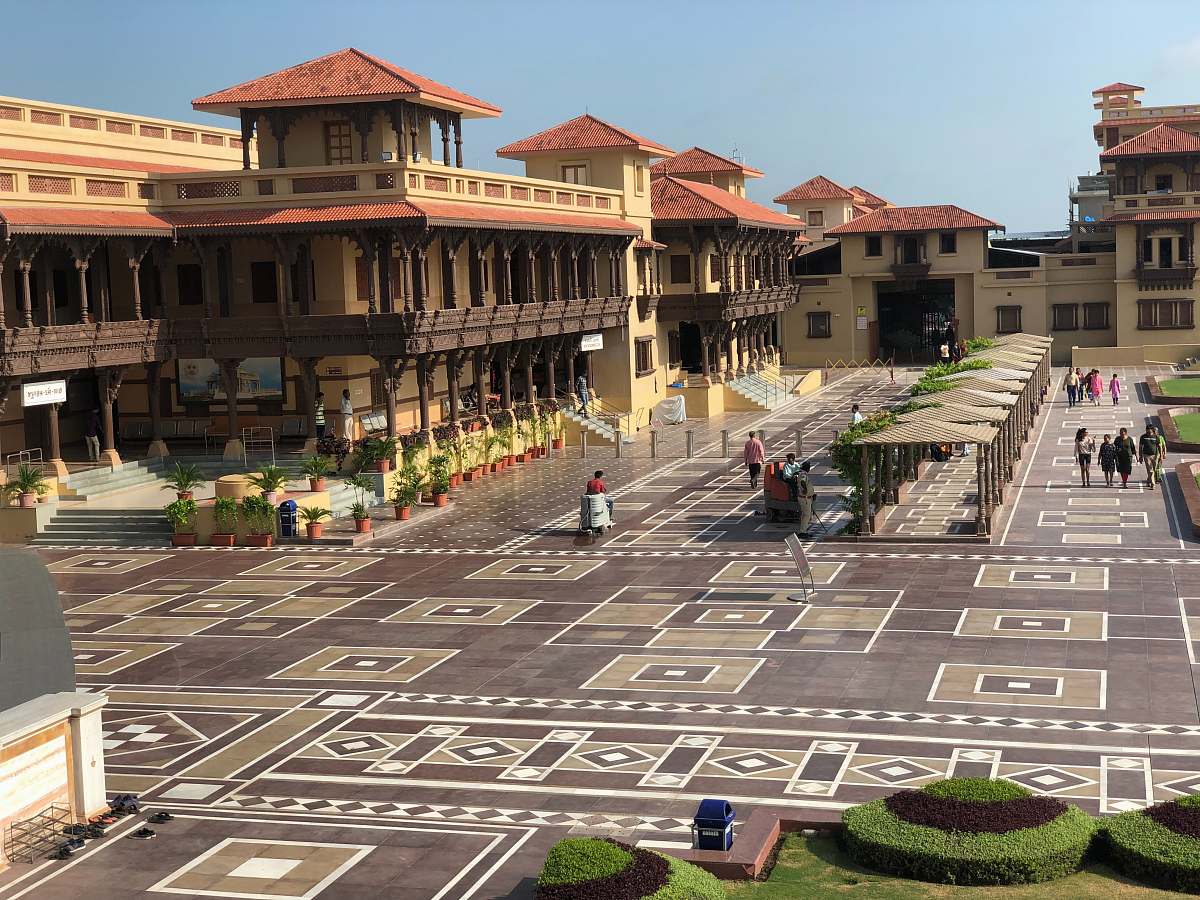 city people near brown building during daytime downtown