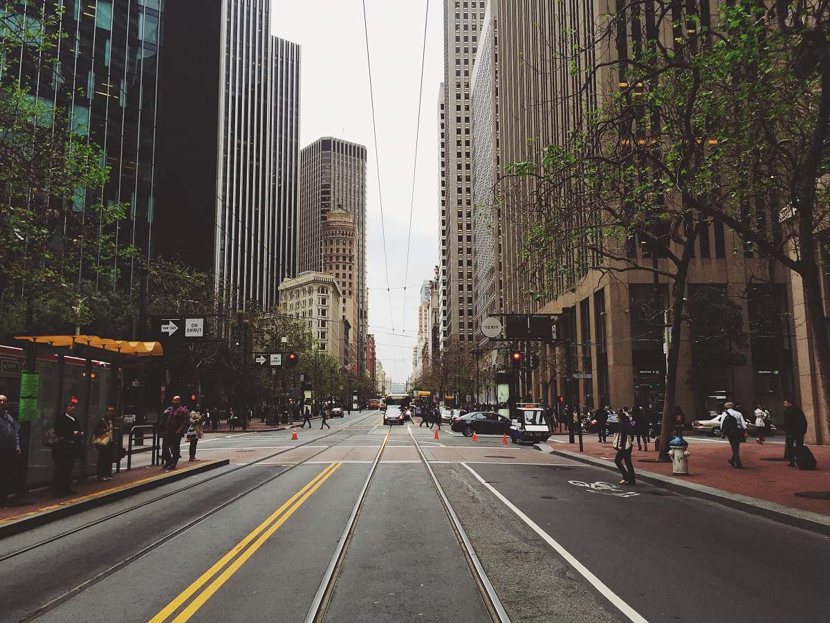 city people walking on city sidewalk street
